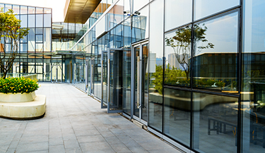 Solar security film protects interior of office building in multiple ways