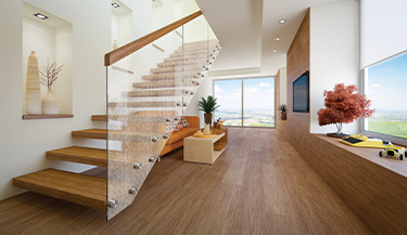 Une pellicule décorative ajoute un effet subtil aux escaliers en verre d’une maison 